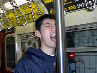 Eric Conveys:  Licking a pole on a NYC subway car
